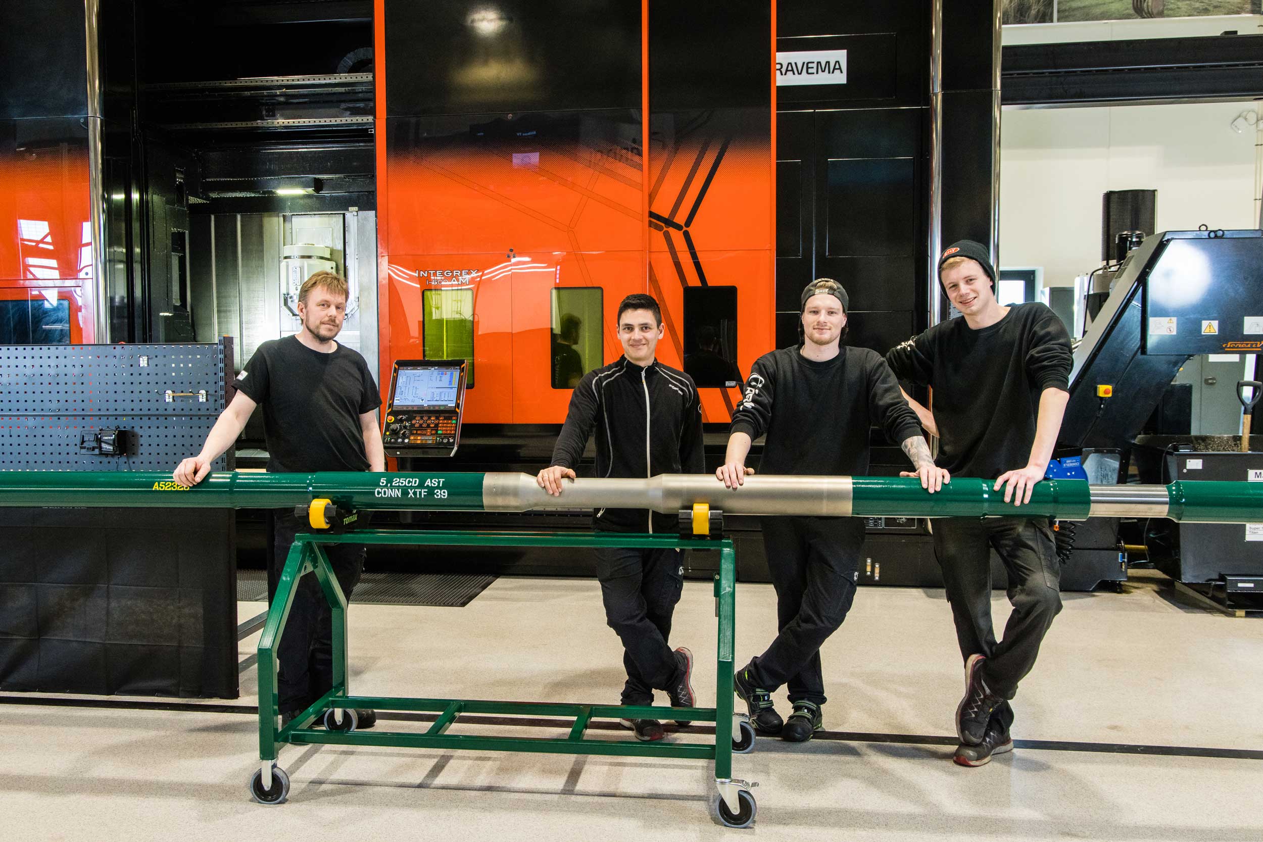 Tomax employees showing the finished AST tool in the warehouse in Norway